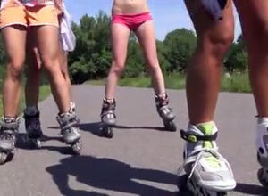 A gang of nude damsels flips on rollers